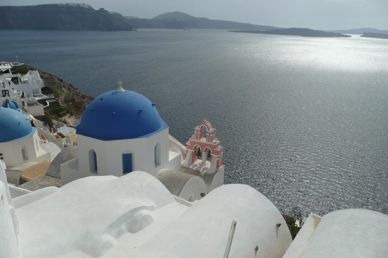 A hiker walks along the scenic path between Fira and Oia on Santorini.