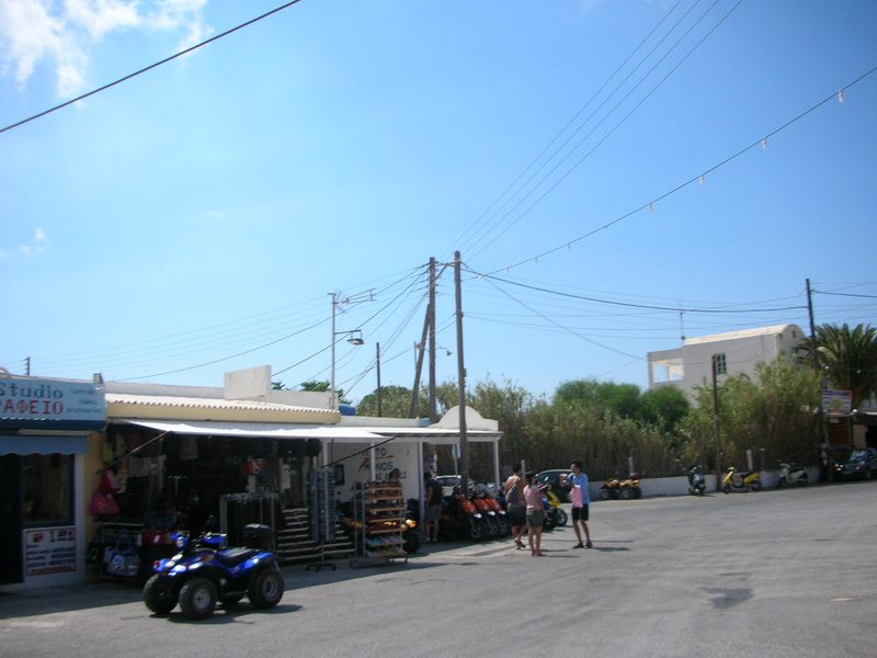 An ATV parked in front of a rental shop in Perissa, Santorini.