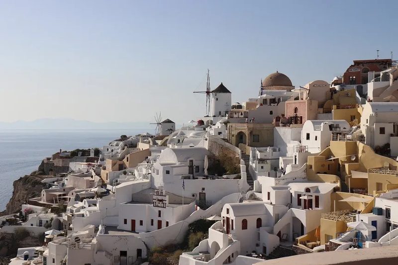 White marbled houses line the sandy beaches of White Beach in Greece.