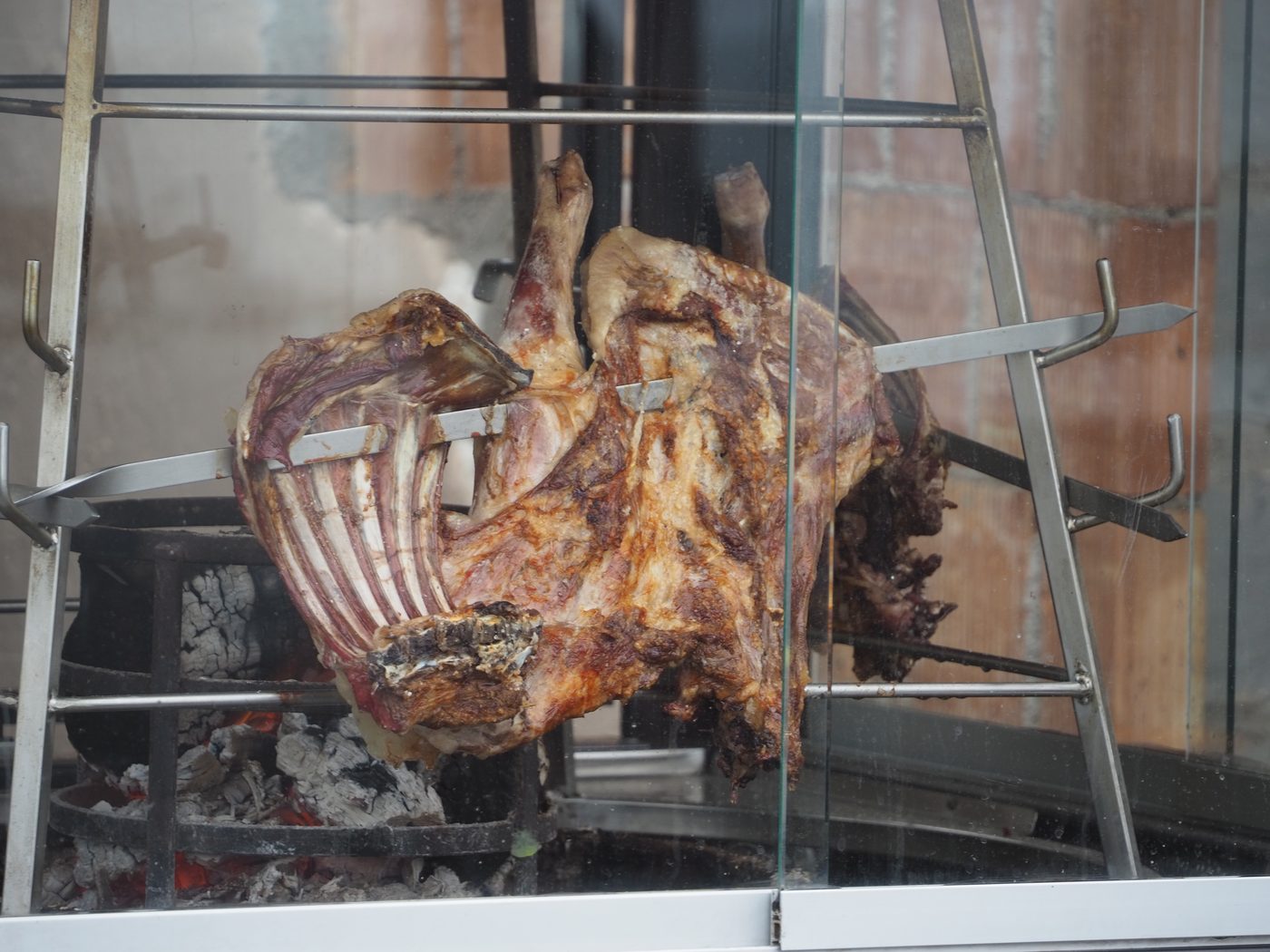 Traditional Greek lamb cooked in an outdoor oven in Santorini
