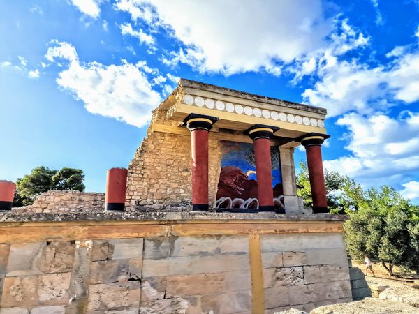 The reconstructed North Propylaeum at Knossos, with its red columns and the charging bull fresco