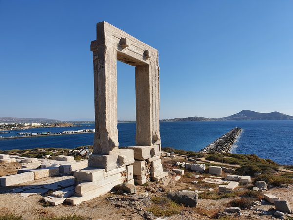 The Portara, the giant marble doorway of the unfinished Temple of Apollo, on the islet by Naxos harbour