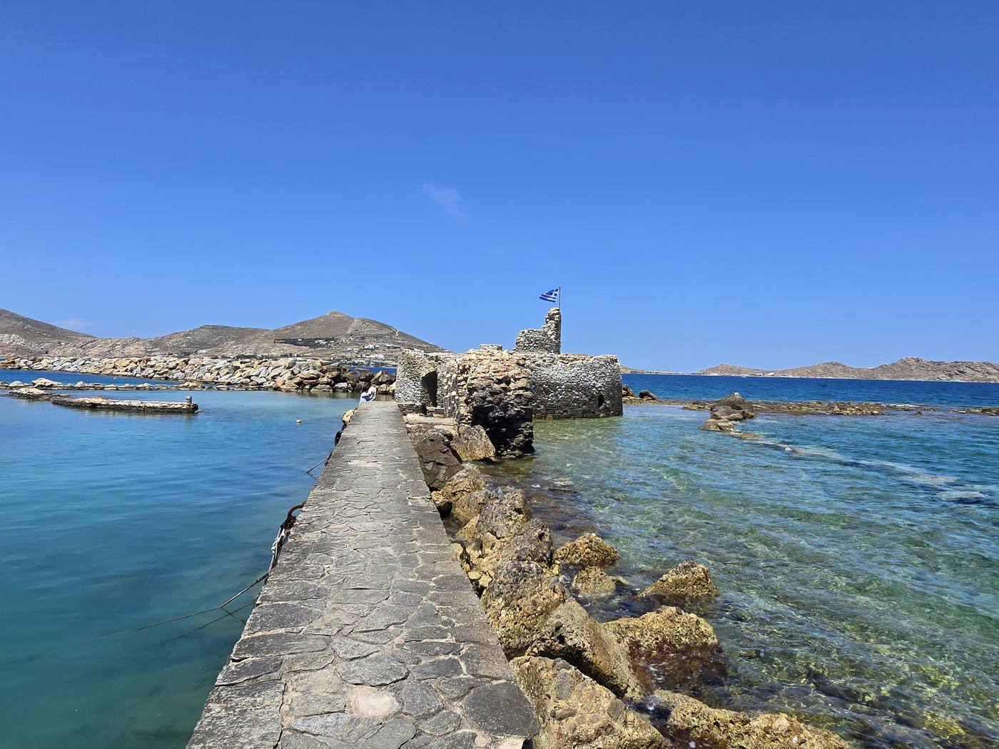 The ruined Venetian castle on the causeway at Naoussa fishing harbour on Paros